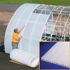 a man standing next to a large white structure