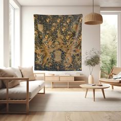 a living room with a large tapestry hanging on the wall