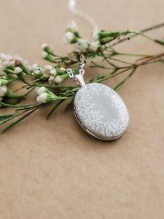 Elegant White Locket Necklace For Keepsake, Elegant White Oval Pendant Locket Necklace, Elegant White Locket Necklace, White Locket Necklace For Memorial, White Oval Keepsake Necklace, White Oval Pendant Necklace With Locket, White Oval Pendant Locket Necklace, White Round Locket Necklace For Keepsake, White Oval Locket Necklace For Anniversary