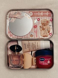 two tins filled with different types of beauty products