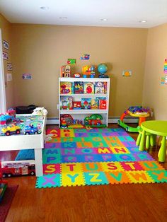 a child's playroom with toys and bookshelves