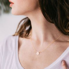 "A minimal and modern pendant slides over a fine chain that ends with a tiny clasp. Delicate and feminine, this necklace is a perfect every day accessory. *pendant measures almost 1\" wide and 0.5\" long *hangs from an adjustable 16-19\" chain finished with a spring ring clasp *available in 14k gold fill or sterling silver *hypoallergenic, nickel-free, and lead-free *handmade in Portland, Oregon, USA, from recycled metals More delicate necklaces: http://etsy.me/1TYiEXx More jewelry: https://www. Delicate Gold Necklace, Gold Circle Necklace, Bar Studs, Gold Circle, Hook Clasp, Circle Necklace, Recycled Metal, Modern Pendant, Circle Pendant