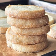 a stack of sugar cookies sitting on top of a counter