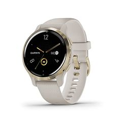 the garmin smart watch is shown in gold and white, with a black face