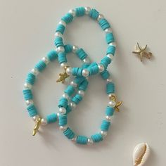 Cute teal starfish beach bracelet Looking for handmade/homemade jewelry? Wel you came to the perfect place: Bracelet Bae Boutique! In my shop you will find beach, tropical, preppy, aesthetic, and more styled jewelry all for a good price! More details about my jewelry: Product information:  -Made by myself -clay beads -seed beads -faux pearls -golden beads -very stretchy elastic -golden chain ♡Shipped from PA in the USA♡ -Sizing on bracelets will be provided on the sizing option. If not please message or contact me. The owner or bracelet bae boutique. -Made in a clean area. -Made from all skin friendly materials If you have any questions or concerns on a product please message me! Main etsy page: https://www.etsy.com/shop/BraceletBaeBoutique?ref=simple-shop-header-name&listing_id=1241074097 Beachy Clay Bead Bracelet, Bracelet Preppy, Tropical Preppy, Styled Jewelry, Clay Bead Bracelet, Blue Clay, Starfish Bracelet, Beach Bracelets