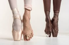 the legs and feet of a ballerina in ballet shoes