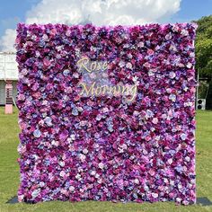 a large purple flowered wall with the words rose morning on it's side