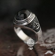 Item Specific Metal: Sterling Silver 92.5% Stone:Onyx size 14*12 mm Dimension: 31 x 19 x 23 mm Ring Weigh: 15.5 g Shipping - Shipping through Thailand Post by Economy Register Mail, taking 90-120 days (or more). - Expedited shipping service through DHL,taking 5-14 days delivery (Non Refundable). Exchange, Return and Refund - If you need to resize, exchange or return, please contact us. Black Engraved Round Ring, Black Spiritual Engraved Ring, Spiritual Black Engraved Sterling Silver Ring, Symbolic Black Sterling Silver Engraved Ring, Symbolic Black Engraved Sterling Silver Ring, Gothic Sterling Silver Oval Ring, Gothic Oval Sterling Silver Rings, Gothic Black Ring Stamped 925, Black Sterling Silver Engraved Ring For Anniversary