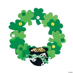 a st patrick's day wreath with buttons and shamrocks on it for decoration