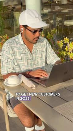 a man sitting at a table with a laptop computer in front of him and the caption reads to get new customers in 202