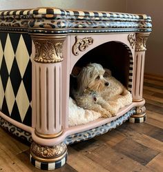 a dog is laying in its bed on the floor