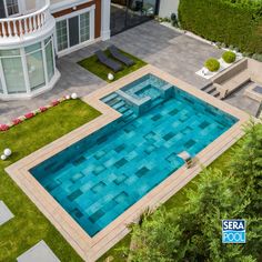 an aerial view of a swimming pool and patio