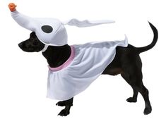 a black dog wearing a white costume with an orange object in it's mouth