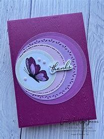 a purple card with a butterfly on it