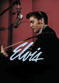 a man standing in front of a microphone with the words elvis written on his face