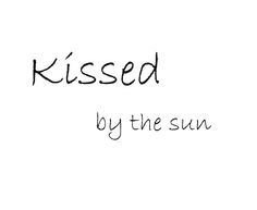 the words kissed by the sun written in black ink