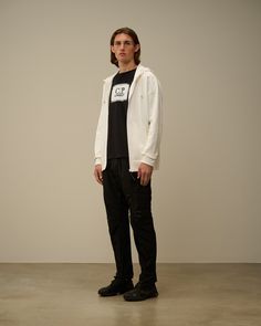 Track pants crafted in Chrome-R, a 100% recycled, shiny multifilament nylon. Made from production waste reprocessed into a new fibre. Garment dyed anti-drop treated. Mesh lining. Man Trousers, Men Sweatshirt, C P Company, The C, Waist Bag, Track Pants, Hooded Sweatshirt, Goggles, Casual Pants