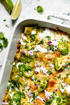 an enchilada casserole with cheese, jalapenos and sour cream