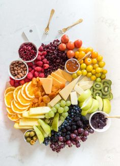 a platter filled with different types of fruits and vegetables