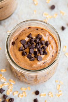 two jars filled with peanut butter and chocolate chips