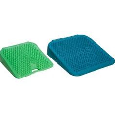 two green and blue mats sitting next to each other