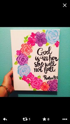 someone holding up a card with flowers on it that says god is another she will not fail