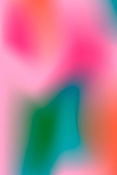 an abstract blurry background with pink, blue and green colors