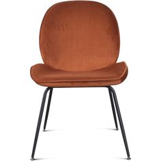 an orange velvet chair with black legs