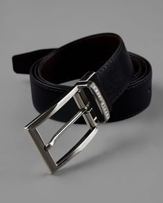 This reversible belt with movable frame buckle by French Crown adds style to your everyday fashion. This belt is made without harming any animal and is perfect to wear on any occasion, whether you are heading for an after-work party or an official meeting. The belt is made using premium material that looks just like real leather and features a matt black finish with a shiny silver buckle, which elevates its look. Reversible Belt: Black colour on side and brown on another. Entirely handmade and c Belt For Men, Reversible Belt, Work Party, Belt Black, Black Colour, Shiny Silver, Mens Belts, Real Leather, Everyday Fashion