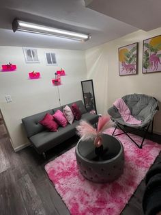 a living room filled with furniture and pink rugs