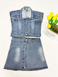 Material:Denim. 90-95% Polyester & Spandex. Features: No stretchy. denim. two-piece outfits. sleeveless. buttons. solid color. high waist. side split. mini skirt.Style: Casual. Clubwear Summer Stretch Denim Blue Denim Vest, Summer Stretch Denim Blue Vest, Stretch Denim Vest For Summer, Sleeveless Stretch Denim Dress, Summer Stretch Denim Vest, Trendy Stretch Blue Denim Vest, Trendy Blue Stretch Denim Vest, Stretch Denim Blue Sleeveless Vest, Fitted High-waist Denim Vest For Spring