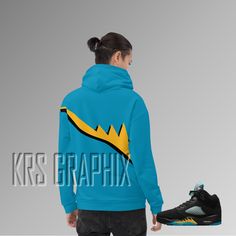 This comfy Jordan 5s 'Aqua' unisex hoodie is a must-have for any sneakerhead! With a soft outside and Fives-inspired vibrant print, and an even softer brushed fleece inside, this hoodie is perfect for wrapping yourself into on a chilly evening. The relaxed fit is comfortable and flattering for both men and women, making it the perfect accessory to show off your love for the iconic Jordan 5s 'Aqua' colorway. Made from a blend of 70% polyester, 27% cotton, and 3% elastane, this hoodie features a s Blue Hip Hop Hoodie For Sports, Sporty Blue Hoodie With Branding, Blue Throwback Sweatshirt For Streetwear, Throwback Blue Sweatshirt For Streetwear, Throwback Blue Sports Hoodie, Blue Throwback Hooded Hoodie, Throwback Blue Hooded Hoodie, Aqua 5s, Jordan Aqua