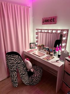 a zebra print high heeled shoe sits in front of a desk with a vanity and mirror