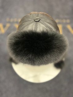 Description Stay warm and stylish with our Genuine Polar Fox Fur Genuine Leather Hat. Made with real Polar fox fur and genuine leather, this winter hat features ear flaps for added protection. Indulge in luxury and sophistication with this exclusive and elegant accessory. Product Details: Shell: genuine leather Fur: genuine Polar Fox Lined for comfort One size fits all Made in Turkey Web ID: A096 Care Instructions: Spot clean when necessary. Luxury Winter Hats With Faux Fur Lining, Luxury Winter Hat With Faux Fur Lining, Leather Hat, Leather Hats, Elegant Accessories, Winter Hat, Fox Fur, Stay Warm, One Size Fits All