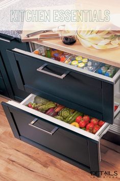 an open drawer in the middle of a kitchen counter with vegetables and fruits inside it