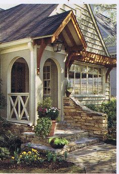 a small house with stone steps leading up to it