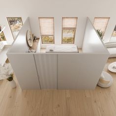 an aerial view of a bedroom with white furniture