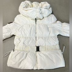 Stay Warm And Stylish This Winter Season With This Triple F.A.T. Goose Down Puffer Jacket. The Jacket Features A Full Zip Hood And Is Made With High-Quality Polyester Material For Durability And Protection. The Insulation Material Is Made Of Down, Providing Extra Warmth And Comfort. This White Puffer Jacket Is Designed For Women In Size L And Is Perfect For Any Casual Occasion. The Jacket Also Comes With A Range Of Features Such As A Hood And A Full Zip That Makes It Easy To Wear And Take Off. G White Winter Outerwear With Drawstring Hood, White Puffer Parka For Fall, Winter White Outerwear With Adjustable Hood, White Winter Outerwear With Adjustable Hood, White Winter Outerwear With Detachable Hood, White Hooded Jacket With Drawstring For Cold Weather, White Outerwear With Double-lined Hood For Winter, White Hooded Parka For Cold Weather, White Hooded Parka With Double-lined Hood