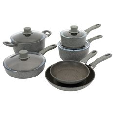 an assortment of pots and pans with lids