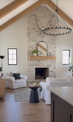 a living room filled with furniture and a fire place