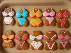 decorated cookies in the shape of bathing suits and bikinis