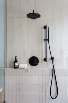 the shower head and hand held shower faucet are black