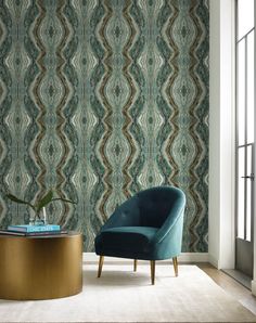 a chair and table in front of a wallpapered room with a large window