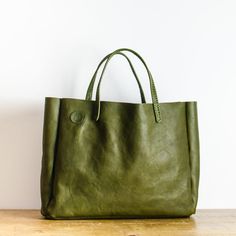 Olive Green Italian Leather Bag - Designed and Made In the UK - Leather Carry All Bag. Each bag is made from Full Grain, World Famous Badalassi Carlo Leather and is finished with hand stitched  handles in the same leather. This leather bag is the perfect size for use as an everyday carryall, as a stylish work bag or a weekend bag. Item Details *Handmade in Manchester, England* Premium  * Quality Full Grain Badalassi Carlo Italian Leather  * Hand-stitched  Approx. external dimensions: Width: 40cm Rectangular Soft Recycled Leather Bag, Rectangular Textured Recycled Leather Bags, Rectangular Recycled Leather Bag, Rectangular Textured Leather Satchel For Everyday Use, Everyday Rectangular Textured Leather Satchel, Textured Leather Square Satchel For Daily Use, Green Rectangular Leather-lined Bag, Square Textured Leather Satchel For Everyday Use, Leather Square Box Bag For Errands