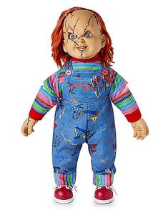 a creepy doll with red hair and blue overalls