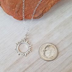 "Sterling Silver Sun Charm Necklace. Wear this pretty sun charm necklace as a reminder to smile, stay positive and let the sunshine in. DETAILS * Sterling Silver Sun/Eclipse Charm measures: (22mm x 16.5mm) or (0.87\" x 0.65\"). * Charm height includes 5mm jump ring. * Sun/Eclipse Charm is marked 925. * 925 Sterling Silver Cable Chain and all Components. LENGTH * Select the necklace length from the drop down menu. * If you are unsure of the length, place a piece of string around your neck and clo Sun-shaped Necklace For Summer Gifts, Sun-shaped Necklace As A Summer Gift, Summer Sun Necklace For Gift, Everyday Sun-shaped Jewelry With Sun Design, Everyday Sun Design Jewelry, Sterling Silver Sun Design Necklace, Eclipse Jewelry, Sun Eclipse, Eclipse Necklace