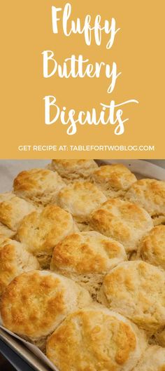 fluffy buttery biscuits in a baking pan with text overlay