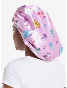 a woman's head wearing a pink hat with cartoon characters on it and white t - shirt