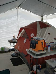 the inside of a tent with several items on it