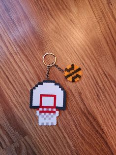 an image of a keychain that is made to look like a video game character